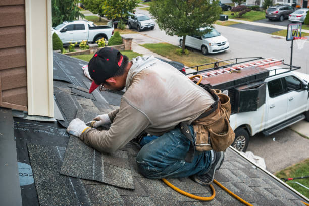 Professional Roofing technician working in East Pembroke, NY
